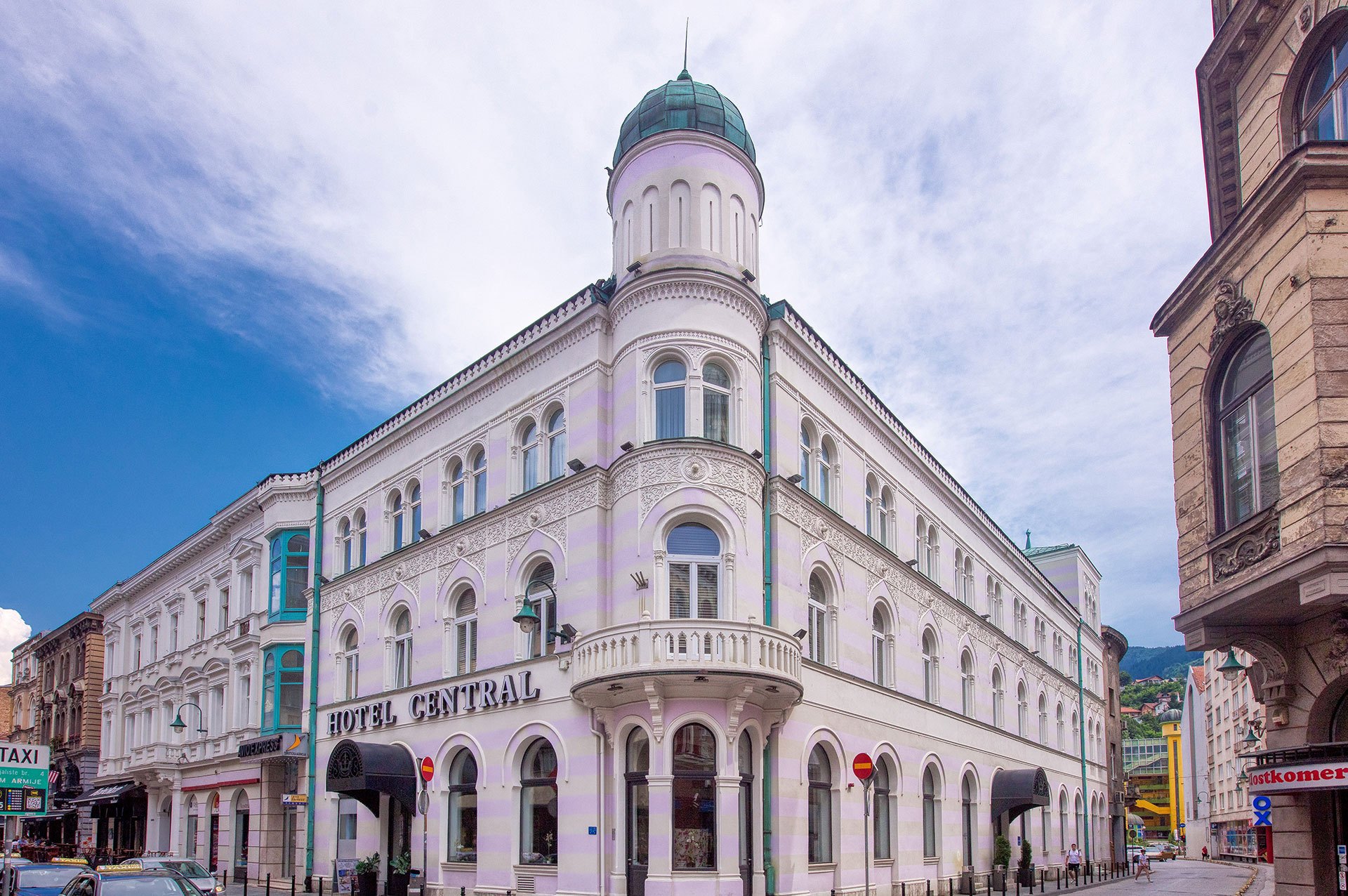 The white corner façade of Hotel Central with its domed tower