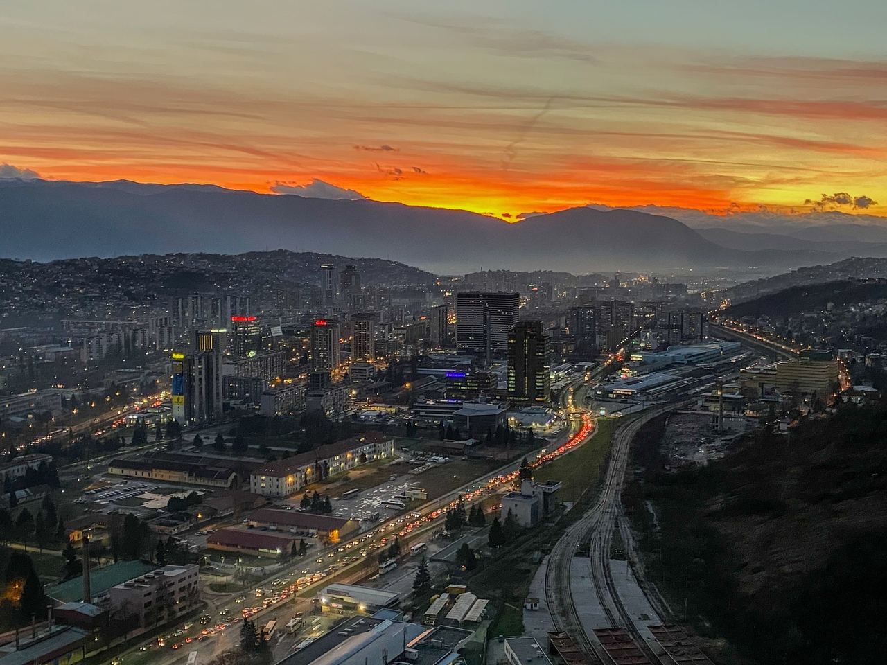 Sarajevo at sunset from the top of the Avaz Twist Tower, with the mountains beyond